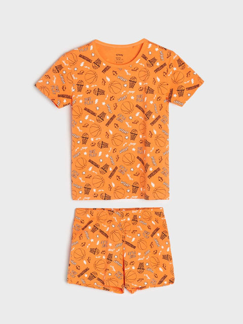 Orange pajama set with dessert pattern on a white background