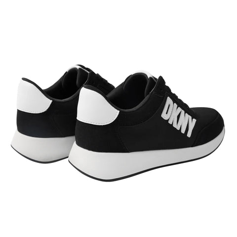 Black and white sneakers with 'DKNY' branding on a white background