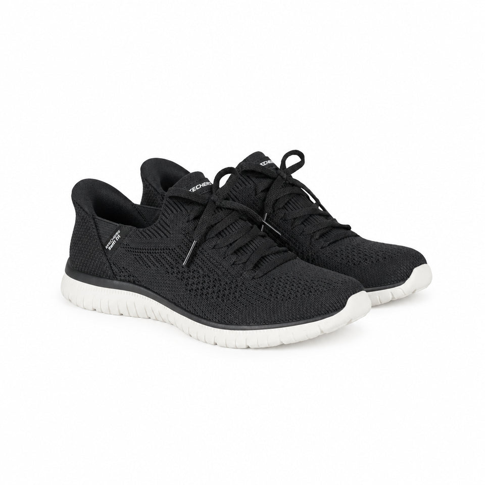 Black athletic shoes with white soles on a white background