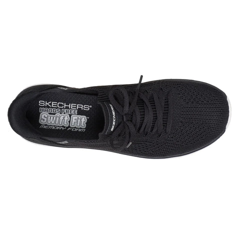 Black sneaker with 'Skechers' branding on a white background