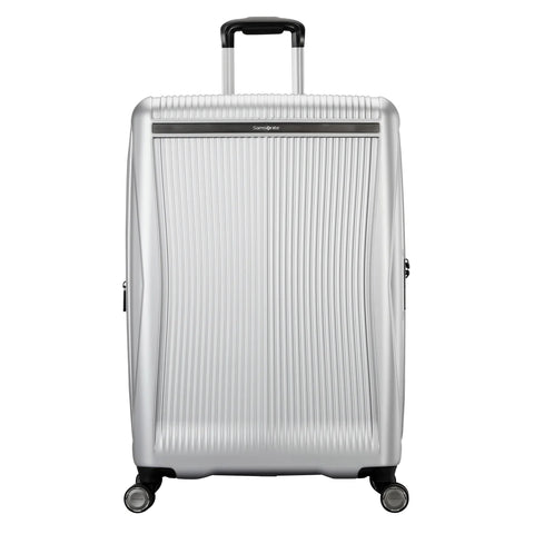 Silver suitcase with a textured surface on a white background