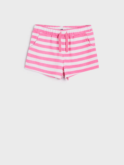 Pink and white striped shorts on a light gray background