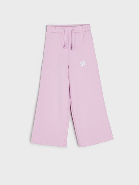 Pink pants with a small logo on a white background