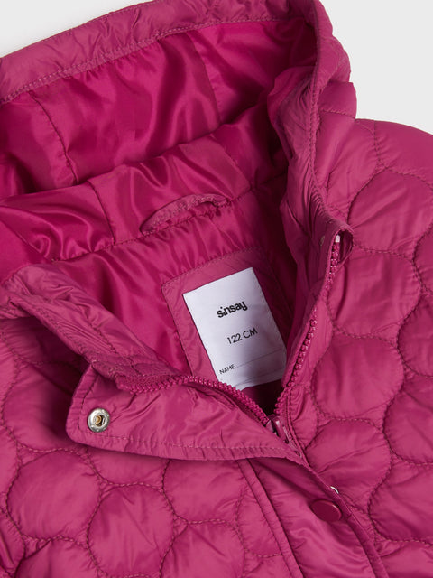 Close-up of a pink quilted jacket with a brand label on a white background