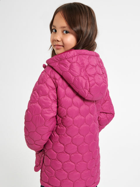 Child wearing a pink quilted jacket on a white background