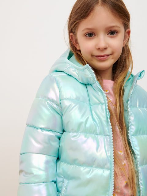 Young girl wearing a light blue puffer jacket on a white background