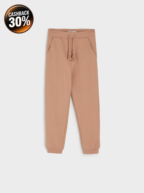 Tan jogger pants on a white background