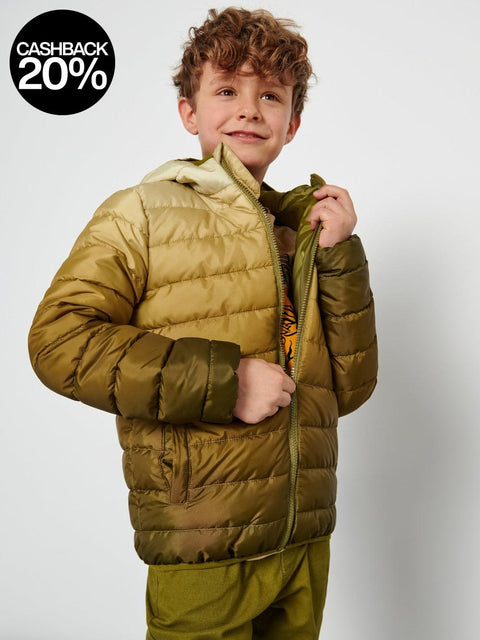 Child wearing a green puffer jacket on a white background