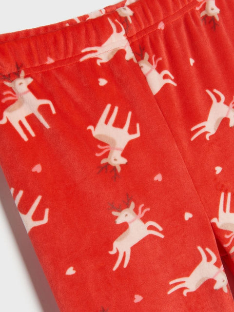 Red fabric with white deer pattern on a white background