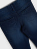 Close-up of blue jeans on a light gray background