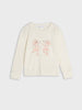 White long-sleeve shirt with pink mouse design on a light gray background
