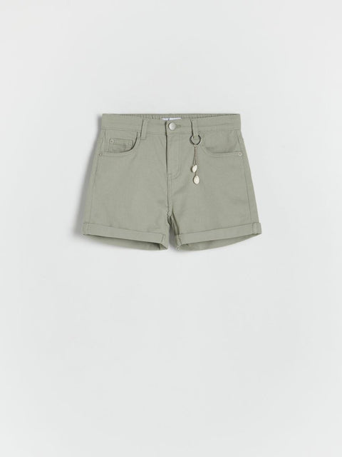 Green shorts on a light gray background