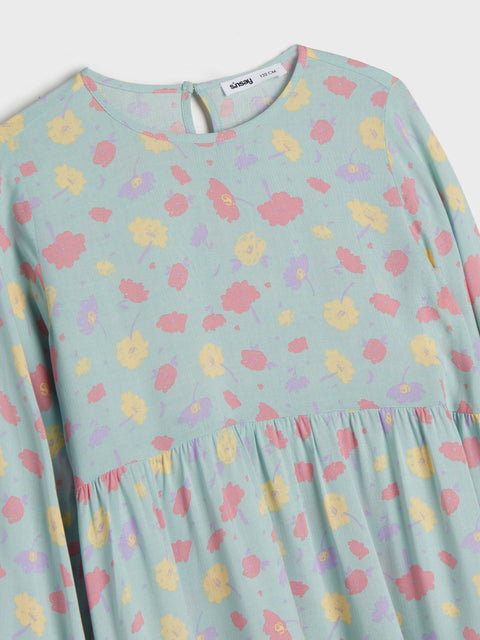 Pastel floral dress with a soft blue background
