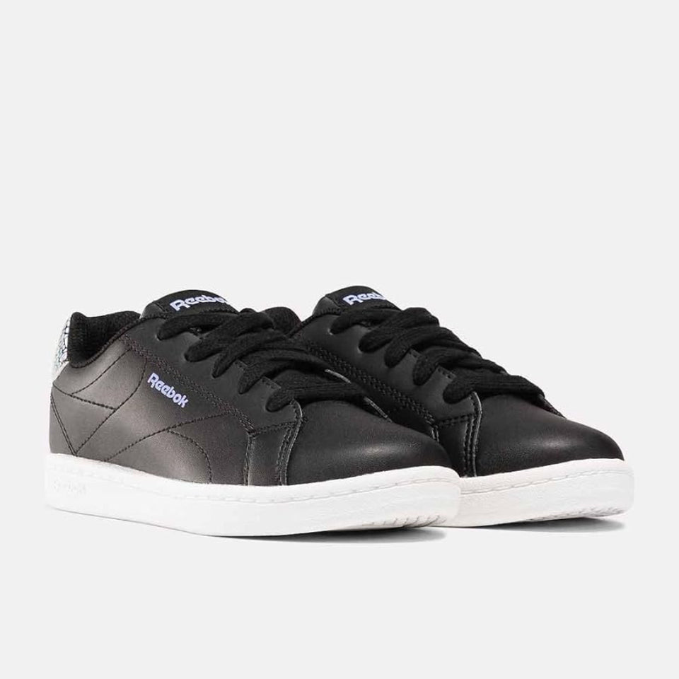 Black Reebok sneakers with white soles on a light gray background