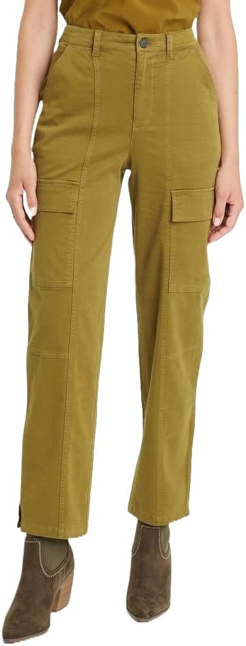 Person wearing mustard yellow cargo pants with a plain background