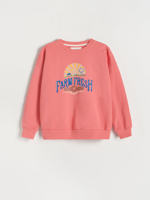 Pink sweatshirt with 'Farm Fresh' text on a light gray background