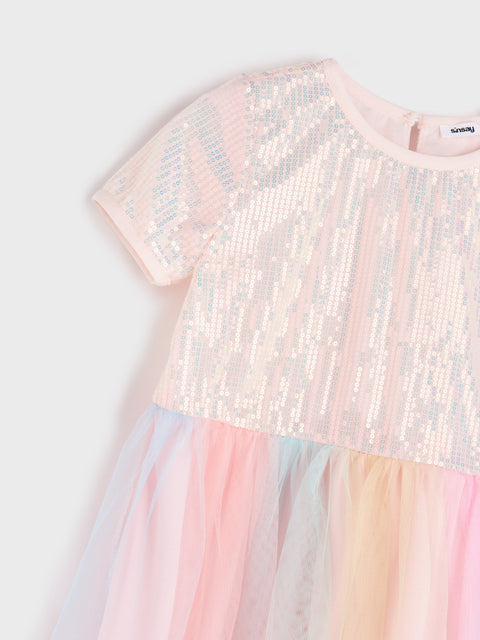 Pastel sequin dress with a white background