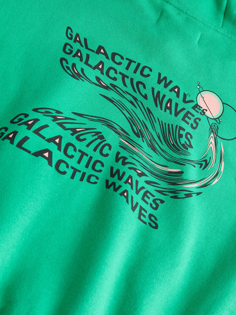 Green sweatshirt with 'Galactic Waves' text and graphic on a green background