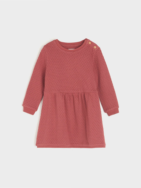 Red dress with long sleeves on a white background