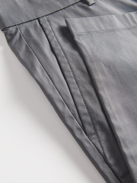 Close-up of gray pants on a light background