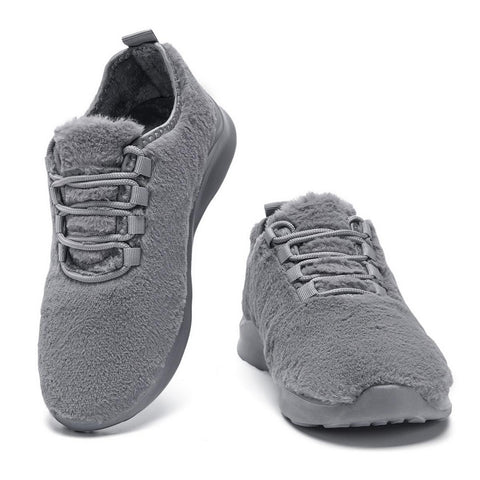 Gray sneakers with fuzzy texture on a white background