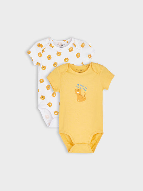Two baby bodysuits, one white with paw prints and one yellow with a bear design, on a light gray background.