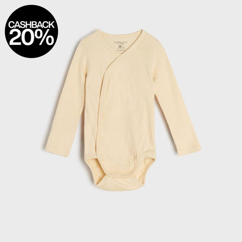 Yellow baby bodysuit with a cardigan on a white background