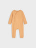 Beige baby onesie on a light gray background
