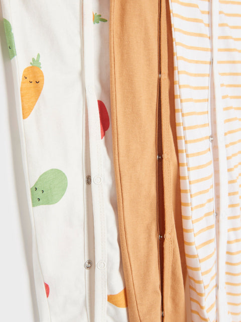 Three baby blankets with different patterns: cartoon vegetables, solid color, and stripes.