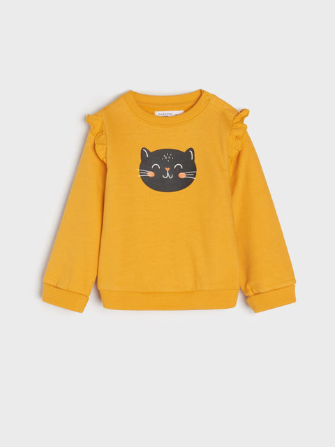 Yellow sweatshirt with a black cat face design on a light gray background