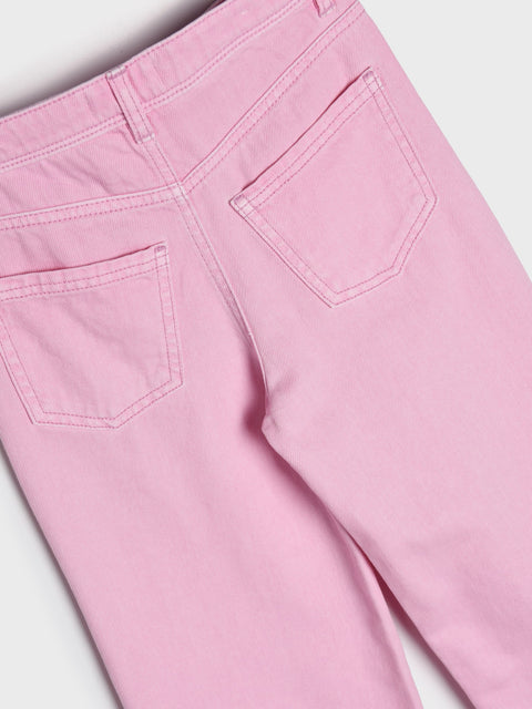 Close-up of pink pants with a plain background