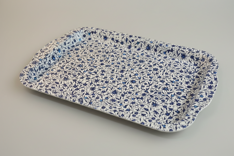 Floral-patterned tray on a wooden surface