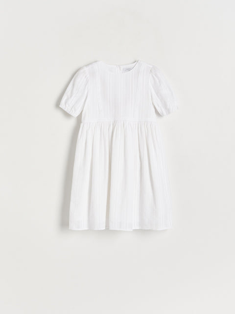 White dress on a light gray background