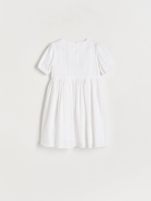 White blouse on a light gray background