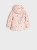 Pink children's coat with cherry pattern on a light gray background