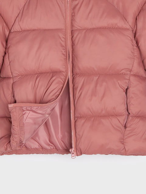Close-up of a pink puffer jacket on a white background