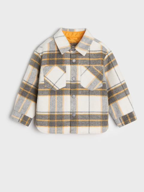 Plaid shirt with a yellow interior on a light gray background