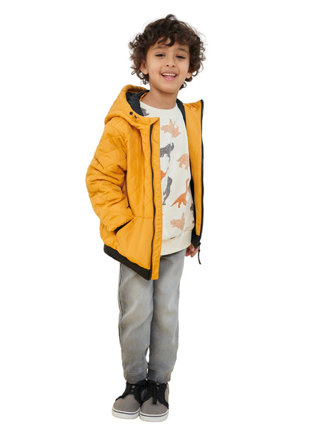 Child wearing a yellow jacket with a white background