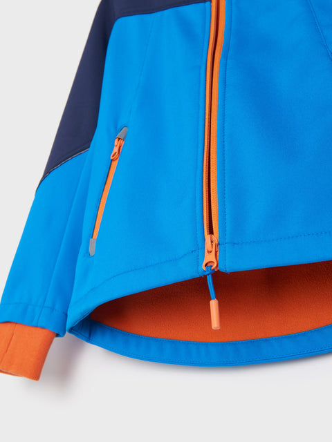 Close-up of a blue and orange jacket with a zipper on a light gray background