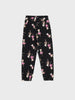 Black leggings with a pattern of cartoon characters on a white background