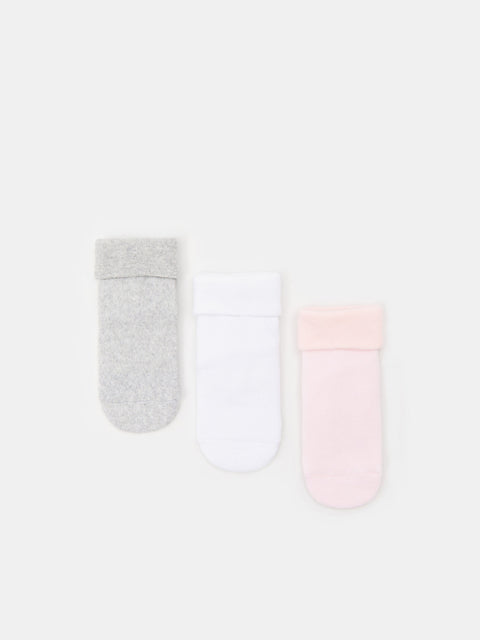 Two pairs of socks, one gray and one pink, on a white background