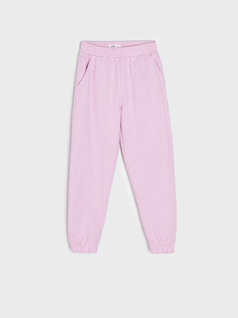 Pink sweatpants on a white background