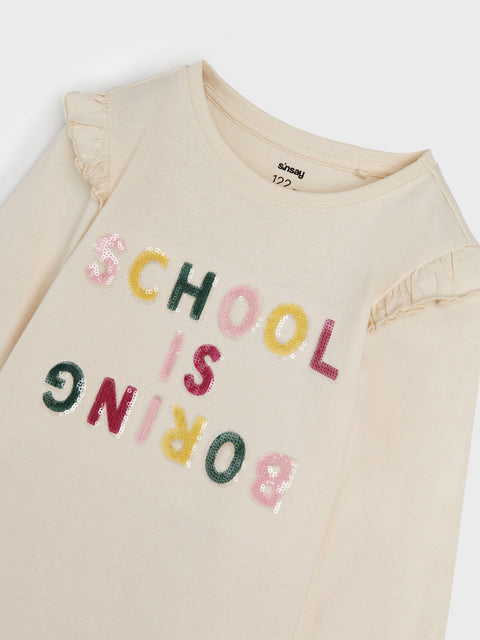 Beige sweatshirt with colorful text 'SCHOOL IS BORING' on a white background