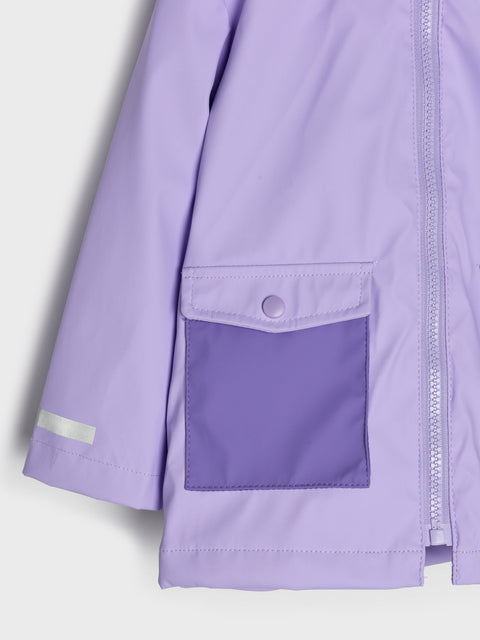 Close-up of a light purple raincoat with a pocket and reflective strip on a white background