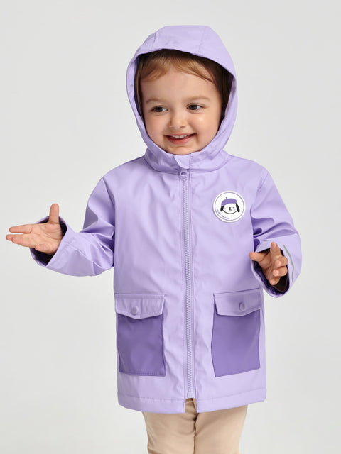Child wearing a purple raincoat with a hood on a white background