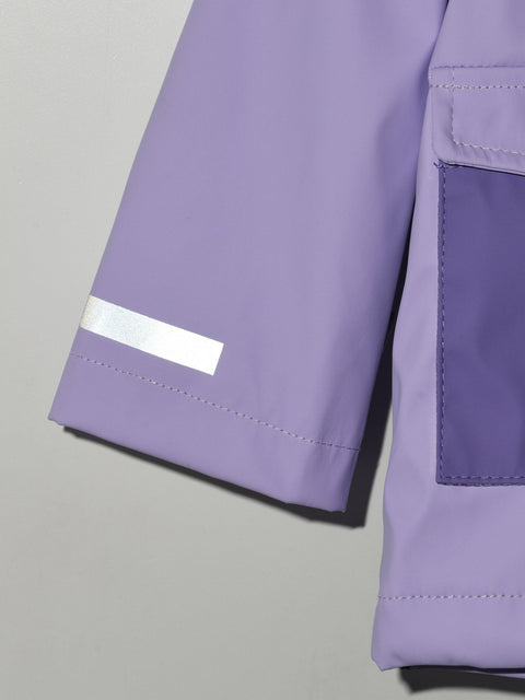 Close-up of a purple jacket with a reflective strip on a gray background