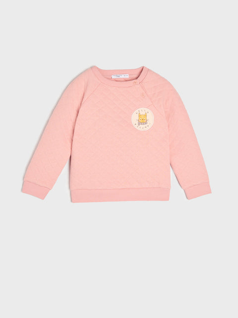 Pink sweatshirt with a logo on a light gray background