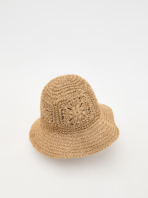 Beige woven hat on a white background