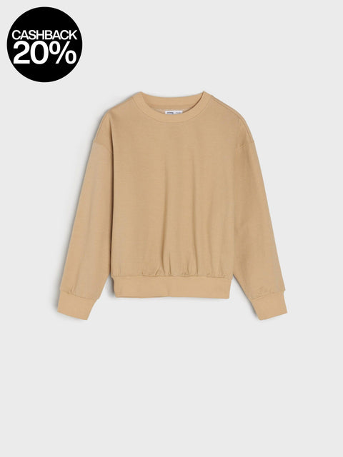 Beige sweater on a light gray background