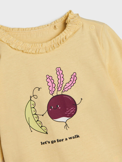 Yellow shirt with a cartoon design of a beet and pea, and text 'let's go for a walk' on a white background.
